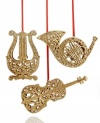 Play a sweet tune. Ring in the holiday season with the golden glimmer of these Musical Instrument ornaments. With red ribbon hanging thread.