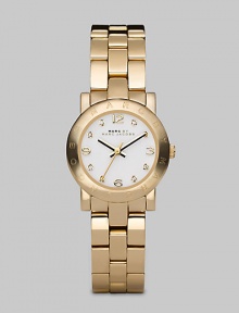 A classic style with a touch of sparkle and an iconic logo bezel. Quartz movementWater resistant to 3 ATMRound goldtone ion-plated stainless steel case, 26mm (1) Logo bezelWhite dialCrystal and numeric hour markersSecond hand Goldtone ion-plated stainless steel link braceletImported A classic style with a touch of sparkle and an iconic logo bezel. Quartz movementWater resistant to 3 ATMRound goldtone ion-plated stainless steel case, 26mm (1) Logo bezelWhite dialCrystal and numeric hour markersSecond hand Goldtone ion-plated stainless steel link braceletImported