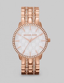 The warm glow of goldtone over stainless steel is rich and elegant, spiced with sparkles around the bezel and link bracelet.Quartz movementWater resistant to 10 ATMRose goldtone-finished round case, 35mm diameter (1.4)Crystal bezelWhite MK logo dialRose goldtone bar hour markersSecond handRose goldtone link bracelet with crystalsImported The warm glow of goldtone over stainless steel is rich and elegant, spiced with sparkles around the bezel and link bracelet.Quartz movementWater resistant to 10 ATMRose goldtone-finished round case, 35mm diameter (1.4)Crystal bezelWhite MK logo dialRose goldtone bar hour markersSecond handRose goldtone link bracelet with crystalsImported