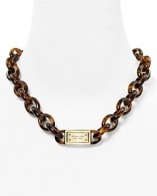Michael Kors' shows its mastery of ever-chic style with this plated metal necklace, accented by retro tortoise shell links. Michael Kors' shows its mastery of ever-chic style with this plated metal necklace, accented by retro tortoise shell links.