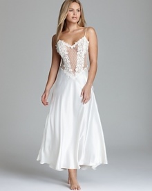 An ethereal gown with an elegant mix of floral applique on sheer mesh. By Flora Nikrooz. An ethereal gown with an elegant mix of floral applique on sheer mesh. By Flora Nikrooz.