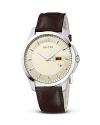 A diamante embossed face on a smooth leather strap lends Gucci's signature look to this versatile, timeless wristwatch.