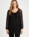 You will certainly sparkle in this chiffon top with a feminine neckline and sequin-adorned front.Drawstring necklineLong sleevesSequin frontCurved hemPull-on styleAbout 30 from shoulder to hemSilkDry cleanImported