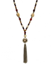 Lauren Ralph Lauren's lovely necklace features a trendy tassel design with semi-precious tiger's eye beads and glass, resin and wood accents. Approximate length: 32 inches + 2-inch extender. Approximate drop: 5-1/2 inches. Lauren Ralph Lauren's lovely necklace features a trendy tassel design with semi-precious tiger's eye beads and glass, resin and wood accents. Approximate length: 32 inches + 2-inch extender. Approximate drop: 5-1/2 inches.