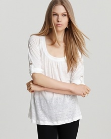 Rendered in airy linen, this white Joie top is summer's update to the laidback tee. Raglan sleeves that roll and tab up with button closures keep things casual, while a fluid silhouette lends chic. Rendered in airy linen, this white Joie top is summer's update to the laidback tee. Raglan sleeves that roll and tab up with button closures keep things casual, while a fluid silhouette lends chic.