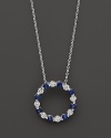 Diamond and sapphire circle pendant in 14K white gold.