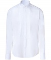 Elegant dress shirt in fine, pure white cotton - A chic twist on the classic button down - Wing collar and long, cuffed sleeves - Pleated shirt front with covered button placket - Hem hangs slightly longer in the back - Slim, straight cut - Polished and versatile, a stylish must in any wardrobe - Pair with suit trousers and a blazer or tuxedo jacket