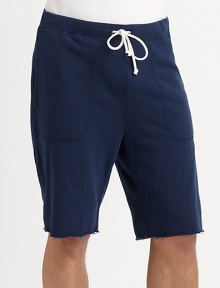 Sporty, cotton-rich design with drawstring waistband and frayed hem for laid-back style.Drawstring, elasticized waistbandSlash pocketsFrayed hemInseam, about 1090% cotton/10% NylonMachine washMade in the USA of imported fabric Sporty, cotton-rich design with drawstring waistband and frayed hem for laid-back style.Drawstring, elasticized waistbandSlash pocketsFrayed hemInseam, about 1090% cotton/10% NylonMachine washMade in the USA of imported fabric