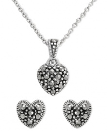 Petite sparkle makes a symbolic statement on Genevieve & Grace's pretty jewelry set. Crafted in sterling silver, tiny hearts glitter with marcasite as decoration. Approximate length: 18 inches. Approximate drop length (pendant): 1/2 inch. Approximate drop width (pendant): 5/16 inch. Approximate diameter (earrings): 5/16 inch. Petite sparkle makes a symbolic statement on Genevieve & Grace's pretty jewelry set. Crafted in sterling silver, tiny hearts glitter with marcasite as decoration. Approximate length: 18 inches. Approximate drop length (pendant): 1/2 inch. Approximate drop width (pendant): 5/16 inch. Approximate diameter (earrings): 5/16 inch.