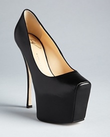 Elevate your entire wardrobe with dramatic, sky-high platform pumps from designer Giuseppe Zanotti, with angles and curves in all the right places. Elevate your entire wardrobe with dramatic, sky-high platform pumps from designer Giuseppe Zanotti, with angles and curves in all the right places.