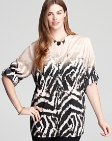 Emboldened by a graphic zebra print, this Calvin Klein Plus top lends exotic inspiration to your everyday look. Finish with tribal accents and take to the top of the fashion pack. Emboldened by a graphic zebra print, this Calvin Klein Plus top lends exotic inspiration to your everyday look. Finish with tribal accents and take to the top of the fashion pack.