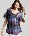Give your off-duty look an opulent boho spin in this sheer Shiloh770 tie dye top with a bejeweled neckline. Make the vintage look modern by pairing it over this season's must-have white jeans.