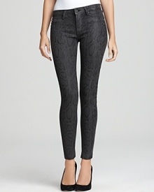 These Hudson skinny jeans go wild with an ever-so-subtle snakeskin print. These Hudson skinny jeans go wild with an ever-so-subtle snakeskin print.