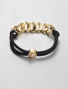 A combination of shiny metal and sporty elastic accented with a turn-lock logo bead. Goldtone-plated brassElasticLength, about 6.2Slip-on styleImported A combination of shiny metal and sporty elastic accented with a turn-lock logo bead. Goldtone-plated brassElasticLength, about 6.2Slip-on styleImported