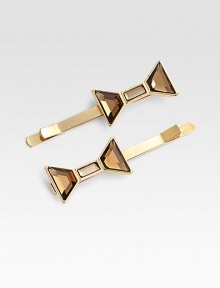 A large, glass bow sits atop a 10k gold-plated bobby pin.10k gold platingGlass bowBrass & steel baseImported A large, glass bow sits atop a 10k gold-plated bobby pin.10k gold platingGlass bowBrass & steel baseImported