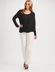 Pretty draping and a crossover design creates a wrap effect. This design also features an attached round-neck tank to complete the look.Draped v-necklineLong sleevesPull-on styleRayonMachine washImported Pretty draping and a crossover design creates a wrap effect. This design also features an attached round-neck tank to complete the look.Draped v-necklineLong sleevesPull-on styleRayonMachine washImported