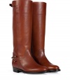 Classic American style boot in fine saddle-brown colored leather - Fashionable equestrian look is simple and elegant with a large shank, rounded toe and small block heel - Features decorative, gold-colored metal latch and buckle - Wear with knit dresses, mini skirts or skinny jeans