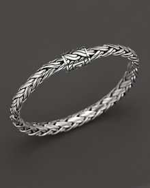Shining sterling silver adds elegance to this hand-woven bracelet, finished with beautiful inner details. Shining sterling silver adds elegance to this hand-woven bracelet, finished with beautiful inner details.