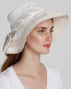 Keep your spring and summer days truly stylish with this Helen Kaminski sun hat. White and tan color blocking give the cotton hat a fresh twist.