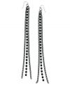 Postmodern chic. This pair of linear earrings from GUESS is crafted from hematite-tone mixed metal with glass crystal stones raising the bar on style. Approximate drop: 7 inches.