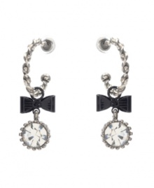 Chic hoops with an extra touch of flirtation. Betsey Johnson earrings feature quarter hoops decorated with bow and round-cut crystal charms. Crafted in silver tone mixed metal. Approximate drop: 2 inches. Chic hoops with an extra touch of flirtation. Betsey Johnson earrings feature quarter hoops decorated with bow and round-cut crystal charms. Crafted in silver tone mixed metal. Approximate drop: 2 inches.