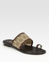 Classic canvas monogram design with rich leather trim and a trend-forward toe ring. Leather and printed canvas upperLeather liningRubber solePadded insoleImported