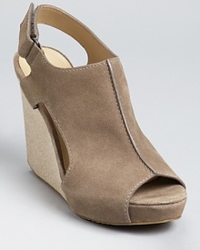 With sleek details, these DKNY wedges feel urban and modern. A seam detail down the front and cut-out sides lend finishing touches. With sleek details, these DKNY wedges feel urban and modern. A seam detail down the front and cut-out sides lend finishing touches.