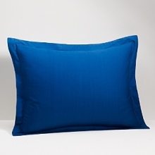 Evocative of a tranquil retreat - crisp white, deep indigo and a mélange of watercolor blues recall the place on the horizon where the sea meets the sky. Subtle woven textures of cotton and raffia complete the collection's breezy, relaxed ambiance. Evocative of a tranquil retreat - crisp white, deep indigo and a mélange of watercolor blues recall the place on the horizon where the sea meets the sky. Subtle woven textures of cotton and raffia complete the collection's breezy, relaxed ambiance.