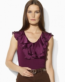 Two layers of sultry ruffles lend feminine appeal to a sleek jersey sleeveless top. Two layers of sultry ruffles lend feminine appeal to a sleek jersey sleeveless top.