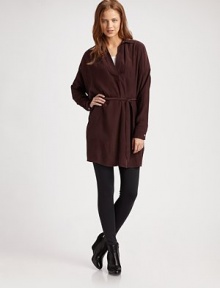 Lengthy silk v-neck with a point collar, slightly shirred back and self-tie at the waist. Point collarV-neckPull-on styleLong dolman sleevesButtoned cuffsSelf tie at waistLonger length hits below the hipsSilkDry cleanImported Lengthy silk v-neck with a point collar, slightly shirred back and self-tie at the waist. Point collarV-neckPull-on styleLong dolman sleevesButtoned cuffsSelf tie at waistLonger length hits below the hipsSilkDry cleanImported