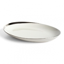 This small platter glows with a hand-painted bright platinum design to create a contemporary classic on your table that will complement your dining experience throughout a lifetime of shifting trends and evolving fashions. This small platter glows with a hand-painted bright platinum design to create a contemporary classic on your table that will complement your dining experience throughout a lifetime of shifting trends and evolving fashions.