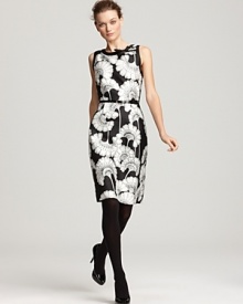 Splashed with a black-and-white fanned floral print, this kate spade new york dress is blank slate for your colorful additions like bold pumps or a cropped cardigan. Splashed with a black-and-white fanned floral print, this kate spade new york dress is blank slate for your colorful additions like bold pumps or a cropped cardigan.