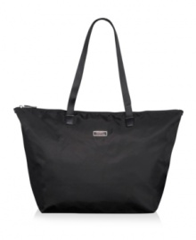 The ideal tag-along! Folding neatly into its own pouch with wristlet, this everyday companion goes everywhere with room for all your daily essentials and must-haves. The sophisticated nylon exterior with leather trim has a back sleeve that easily fits over extended luggage handles for the ultimate in versatility. Five-year warranty. The ideal tag-along! Folding neatly into its own pouch with wristlet, this everyday companion goes everywhere with room for all your daily essentials and must-haves. The sophisticated nylon exterior with leather trim has a back sleeve that easily fits over extended luggage handles for the ultimate in versatility. Five-year warranty.