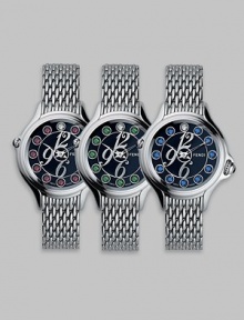 Dazzling topaz stones accent this classic, stainless steel design featuring a unique rolling gemstone mechanism that changes the semiprecious markers for three different looks, with a single stationary diamond at 12.Swiss quartz movement Water resistant to 3 ATM Round stainless steel case, 38mm, (1.49) Black dial Topaz and single diamond markers, 2.9 tcw Arabic numeral hour markers Bracelet strap Made in Switzerland Dazzling topaz stones accent this classic, stainless steel design featuring a unique rolling gemstone mechanism that changes the semiprecious markers for three different looks, with a single stationary diamond at 12.Swiss quartz movement Water resistant to 3 ATM Round stainless steel case, 38mm, (1.49) Black dial Topaz and single diamond markers, 2.9 tcw Arabic numeral hour markers Bracelet strap Made in Switzerland