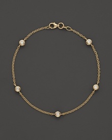 Diamond stations on a fine yellow gold chain bracelet.