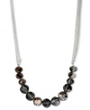 This elegant Kenneth Cole New York necklace features chic clusters of hematite-colored glass cherry beads strung on multi-chains. Crafted in silver tone mixed metal. Approximate length: 16 inches + 3-inch extender. Approximate drop: 3/8 inch.