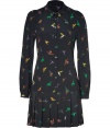 This pure silk shirtdress is a whimsical take on the classic button-down blouse - Features a rounded collar, long sleeves, buttoned cuffs, subtle puff at shoulder, full button placket, and feminine pleats in mini-length skirt - Allover colorful hummingbird print on soft black background - Wear to the office with textured stockings and platforms, or to lunch with tights and booties for an edgy daytime look