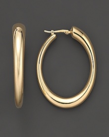 Oval hoops in matte 14K yellow gold. Oval hoops in matte 14K yellow gold.