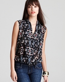 This effortless Aqua blouse sports a cool tribal print for a winning weekend look. This effortless Aqua blouse sports a cool tribal print for a winning weekend look.