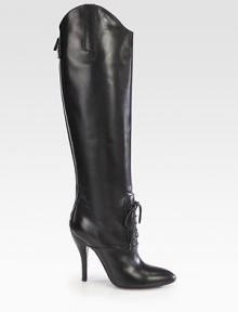 Towering high-heel boot of Italian leather, with a lace-up front and asymmetrical silhouette. Self-covered heel, 4½ (115mm)Shaft, 19Leg circumference, 13½Leather upperLace-up front with back zipBack strap with snap closureLeather lining and solePadded insoleMade in Italy Towering high-heel boot of Italian leather, with a lace-up front and asymmetrical silhouette. Self-covered heel, 4½ (115mm)Shaft, 19Leg circumference, 13½Leather upperLace-up front with back zipBack strap with snap closureLeather lining and solePadded insoleMade in Italy