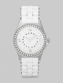 A combination of sporty and glitzy with a silicon wrapped bracelet and sparkling crystal bezel.Quartz movement Water resistant to 3 ATM Crystal bezel Round stainless steel case, 36.5mm, (1.43) White dial with concave ring Numeral and dot hour markers Second hand Silicon wrapped stainless steel bracelet, 18mm, (.71) Imported A combination of sporty and glitzy with a silicon wrapped bracelet and sparkling crystal bezel.Quartz movement Water resistant to 3 ATM Crystal bezel Round stainless steel case, 36.5mm, (1.43) White dial with concave ring Numeral and dot hour markers Second hand Silicon wrapped stainless steel bracelet, 18mm, (.71) Imported