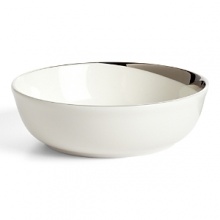 This fruit bowl glows with a hand-painted bright platinum design to create a contemporary classic on your table that will complement your dining experience throughout a lifetime of shifting trends and evolving fashions. This fruit bowl glows with a hand-painted bright platinum design to create a contemporary classic on your table that will complement your dining experience throughout a lifetime of shifting trends and evolving fashions.