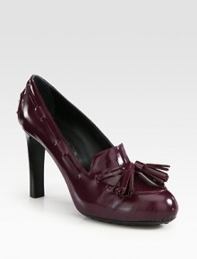 Twin fringe tassels add playful style to this classic leather pump. Stacked heel, 4 (100mm)Leather upperLeather liningRubber solePadded insoleMade in Italy Twin fringe tassels add playful style to this classic leather pump. Stacked heel, 4 (100mm)Leather upperLeather liningRubber solePadded insoleMade in Italy