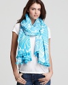 Wrap your waistline in a bright blue pareo with a swishing pattern and small tassle fringe for a cool, beachy look.