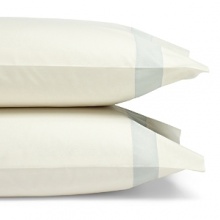 A classic sateen border trims these pillowcases by SFERRA, woven from super soft Egyptian cotton. A classic sateen border trims these pillowcases by SFERRA, woven from super soft Egyptian cotton.