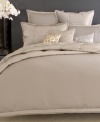 A shimmering foil print on a soft velvet ground offers enchanting elegance in this nature-inspired decorative pillow from Donna Karan. Zipper closure.