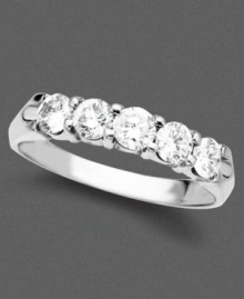 A pristine 14k white gold ring with a stunning arrangement of five brilliant round-cut diamonds (3/4 ct. t.w.). A pristine 14k white gold ring with a stunning arrangement of five brilliant round-cut diamonds (3/4 ct. t.w.).