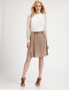 Crisply-tailored cotton poplin finished with plisse pleats, a flared hem and silk chiffon sleeves.Band collarPleated button-down placketSilk chiffon sleeves and side insetsInverted back pleatAbout 38 from shoulder to hemBody: cotton; sleeves: silkDry cleanMade in USAModel shown is 5'10½ (179cm) wearing US size 4. Crisply-tailored cotton poplin finished with plisse pleats, a flared hem and silk chiffon sleeves.Band collarPleated button-down placketSilk chiffon sleeves and side insetsInverted back pleatAbout 38 from shoulder to hemBody: cotton; sleeves: silkDry cleanMade in USAModel shown is 5'10½ (179cm) wearing US size 4.