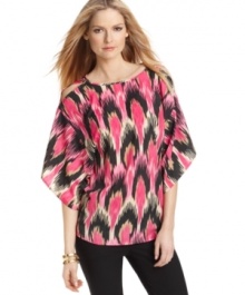 A bold global-inspired print makes a chic statement on this stylishly slouchy MICHAEL Michael Kors top -- sleeve cutouts show a hint of skin! A bold global-inspired print makes a chic statement on this stylishly slouchy MICHAEL Michael Kors top -- sleeve cutouts show a hint of skin!