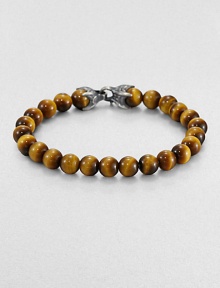 A natural look is a fabulous match for any ensemble, laced with smooth tiger's eye beads.Silver chevron clasp8 mm beadsAbout 8½ longImported A natural look is a fabulous match for any ensemble, laced with smooth tiger's eye beads.Silver chevron clasp8 mm beadsAbout 8½ longImported